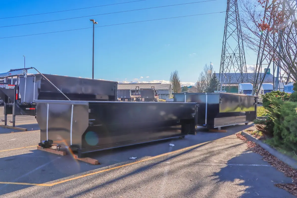 Roll-off dumpster ready for waste disposal at job site for 3 Yard Dumpster Rental in Brookings